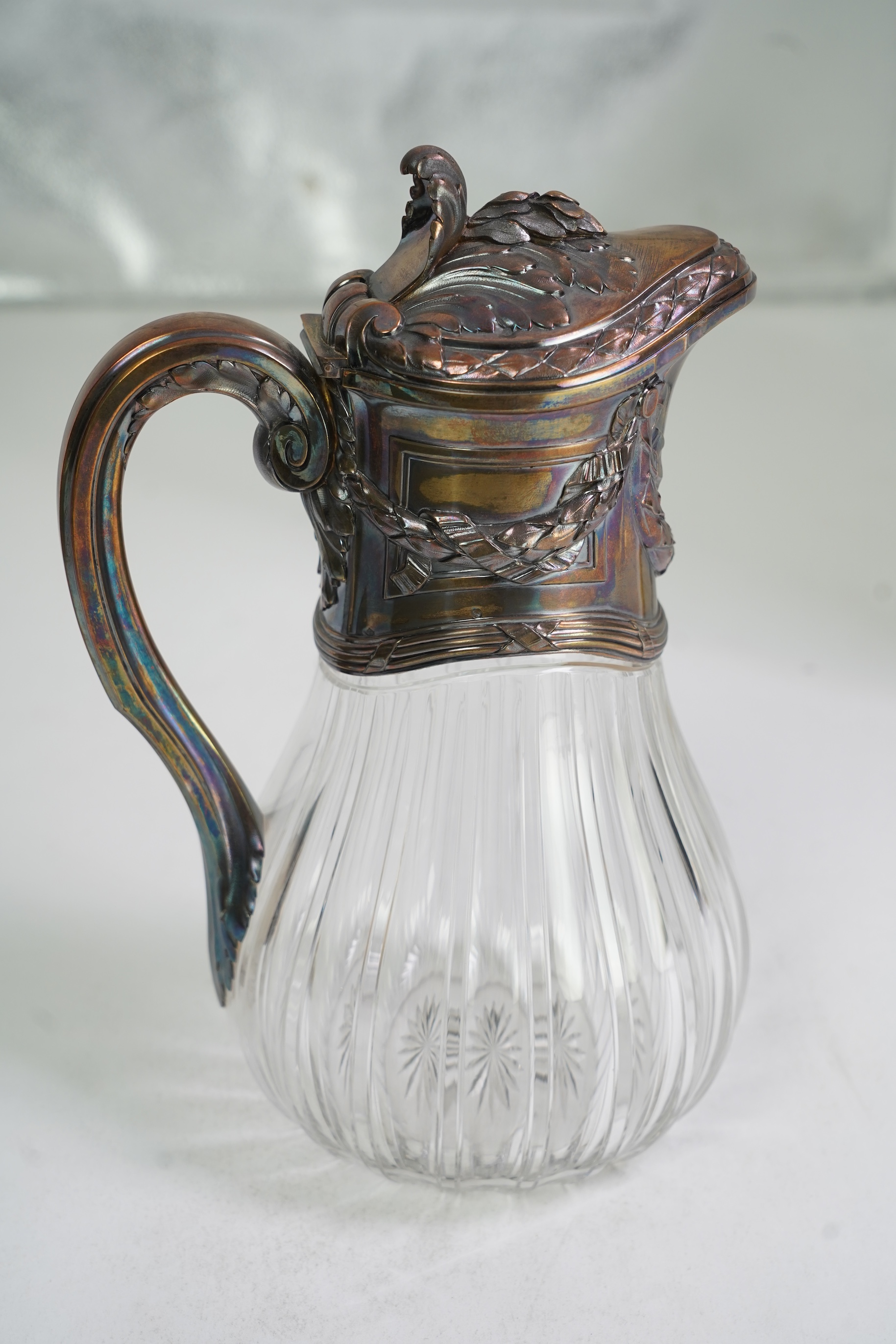 An early 20th century French 950 standard white metal mounted glass claret jug, by Risler & Carre